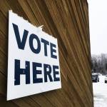 Snow clings to a sign marking a polling place at the Soldotna Regional Sports Complex on Tuesday, Oct. 24, 2017 in Soldotna, Alaska. Kenai Peninsula voters chose between borough mayoral candidates Linda Hutchings and Charlie Pierce in the Tuesday runoff election. (Photo by Elizabeth Earl/Peninsula Clarion)