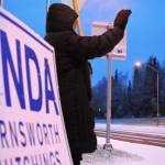Borough mayoral candidate Linda Hutchings waves at passing cars at the intersection of the Sterling and Kenai Spur highways on Tuesday, Oct. 24, 2017 in Soldotna, Alaska. Kenai Peninsula voters chose between Hutchings and candidate Charlie Pierce during the mayoral runoff race Tuesday. (Photo by Elizabeth Earl/Peninsula Clarion)