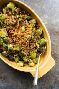 This Feb. 13 photo shows pan-roasted Brussels sprouts with chorizo and toasted bread crumbs. This dish is from a recipe by Katie Workman. (Sarah Crowder via AP)