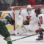 Kenai Central goaltender Josh Tree blocks a shot from Service&rsquo;s Andre Gaskov Thursday at the Peninsula Ice Challenge at the Soldotna Regional Sports Complex. (Photo by Joey Klecka/Peninsula Clarion)
