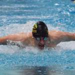 Seward&rsquo;s Connor Spanos races in the boys 100-yard butterfly final Saturday at the ASAA First National Bank State Swimming & Diving Championships at the Bartlett High pool. (Photo by Joey Klecka/Peninsula Clarion)