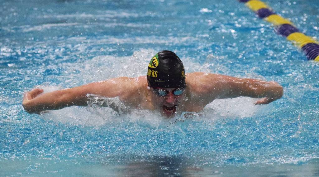 Seward&rsquo;s Connor Spanos races in the boys 100-yard butterfly final Saturday at the ASAA First National Bank State Swimming & Diving Championships at the Bartlett High pool. (Photo by Joey Klecka/Peninsula Clarion)