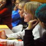 Riley Smith, a second-grader at Kalifornsky Beach Elementary School, makes a face during a witness&rsquo;s statement during the class&rsquo;s mock trial of &ldquo;Arthur T. Grinch,&rdquo; based on the Dr. Seuss classic &ldquo;How the Grinch Stole Christmas&rdquo; on Thursday, Nov. 9, 2017 in Kenai, Alaska. The class has been studying civics and learning about the court process and put on a mock sentencing hearing, complete with witnesses and a jury composed of students&rsquo; parents and K-Beach Elementary Principal Nate Crabtree. (Photo by Elizabeth Earl/Peninsula Clarion)