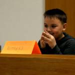 River Kruzick, a second-grader at Kalifornsky Beach Elementary School, prepares to answer a question during his testimony as &ldquo;Arthur T. Grinch&rdquo; during the class&rsquo;s mock trial based on Dr. Seuss&rsquo;s classic &ldquo;How the Grinch Stole Christmas&rdquo; on Thursday, Nov. 9, 2017 in Kenai, Alaska. The class has been studying civics and learning about the court process and put on a mock sentencing hearing, complete with witnesses and a jury composed of students&rsquo; parents and K-Beach Elementary Principal Nate Crabtree. (Photo by Elizabeth Earl/Peninsula Clarion)