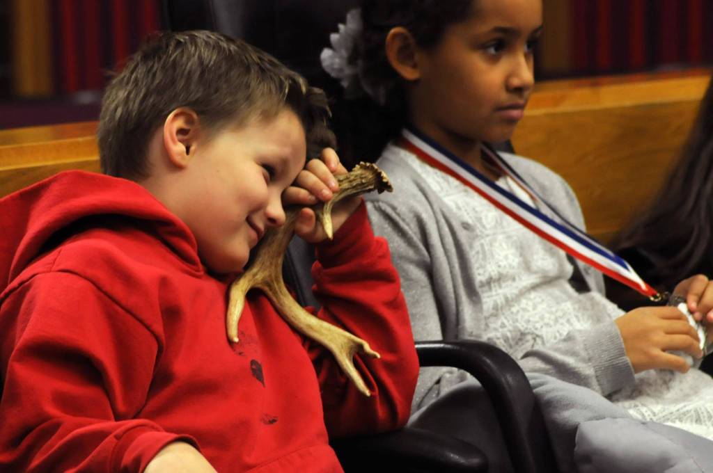 James Hartness, a second grader at Kalifornsky Beach Elementary School, playing the character of &ldquo;Max,&rdquo; listens during a witness&rsquo;s testimony during the class&rsquo;s mock trial of &ldquo;Arthur T. Grinch,&rdquo; based on Dr. Seuss&rsquo;s classic &ldquo;How the Grinch Stole Christmas&rdquo; on Thursday, Nov. 9, 2017 in Kenai, Alaska. The class has been studying civics and learning about the court process and put on a mock sentencing hearing, complete with witnesses and a jury composed of students&rsquo; parents and K-Beach Elementary Principal Nate Crabtree. (Photo by Elizabeth Earl/Peninsula Clarion)