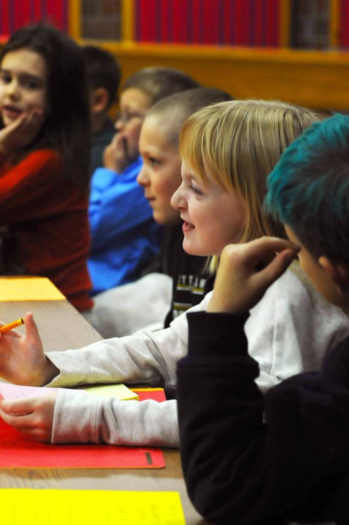 Riley Smith, a second-grader at Kalifornsky Beach Elementary School, makes a face during a witness&rsquo;s statement during the class&rsquo;s mock trial of &ldquo;Arthur T. Grinch,&rdquo; based on the Dr. Seuss classic &ldquo;How the Grinch Stole Christmas&rdquo; on Thursday in Kenai. The class has been studying civics and learning about the court process and put on a mock sentencing hearing, complete with witnesses and a jury composed of students&rsquo; parents and K-Beach Elementary Principal Nate Crabtree. (Photo by Elizabeth Earl/Peninsula Clarion)