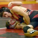 Kenai Central&rsquo;s Brandon Kroto prepares to pin Soldotna&rsquo;s Aiden Willets at 145 pounds Thusday, Nov. 9, 2017, at Kenai Central High School. (Photo by Jeff Helminiak/Peninsula Clarion)