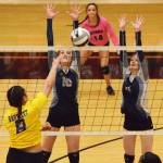 Soldotna juniors Aliann Schmidt (10) and Kodi McGillivray team up for a block against Bartlett&rsquo;s Violett Togaga&rsquo;e (8) Thursday at the Class 4A state volleyball tournament at West High School. (Photo by Joey Klecka/Peninsula Clarion)