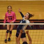 Soldotna senior Ella Stenga winds up for a kill point against Bartlett&rsquo;s Kendra Camell Thursday at the Class 4A state volleyball tournament at West High School. (Photo by Joey Klecka/Peninsula Clarion)
