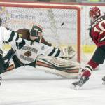 Miroslav Mucha scores on the power play for the Minot Minotauros on Friday, Nov. 10, 2017, at the Soldotna Regional Sports Complex against Kenai River goalie Gavin Enright. (Photo by Jeff Helminiak/Peninsula Clarion)
