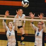 Nikiski junior Bethany Carstens (7) teams up with senior Jamie Yerkes to put up a block Friday against Barrow at the Class 3A state volleyball tournament at West High School. (Photo by Joey Klecka/Peninsula Clarion)