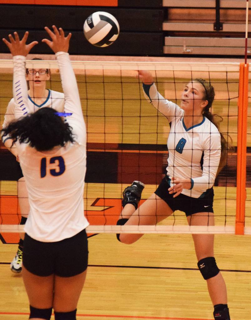 Nikiski sophomore Kaitlyn Johnson sends a ball into the Barrow court Friday at the Class 3A state volleyball tournament at West High School. (Photo by Joey Klecka/Peninsula Clarion)
