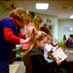 Teachers and students at Nikiski North Star Elementary in Nikiski, Alaska filled the library on Thursday, Nov. 9 morning at the first Stories with Style, a weekly event that transforms the library into a hair salon. (Photo by Kat Sorensen/Peninsula Clarion)