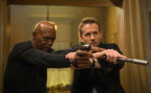 This image released by Lionsgate shows Samuel L. Jackson, left, and Ryan Reynolds in &ldquo;The Hitman&rsquo;s Bodyguard.&rdquo; (Jack English/Lionsgate via AP)