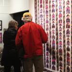 Passersby inspect the work of the Kachemak Bay Quilters during a First Friday exhibit Nov. 3 at the Homer Council on the Arts in Homer. The quilting group has been around for more than 30 years. (Photo by Megan Pacer/Homer News)