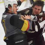 Kenai River&rsquo;s Alex Klekotka (right) throws down the fisticuffs with Bismarck&rsquo;s Noah Bormann Friday night against the Bismarck Bobcats at the Soldotna Regional Sports Complex. (Photo by Joey Klecka/Peninsula Clarion)