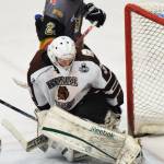 Kenai River goaltender Artur Pavliukov eyes the puck as it rolls across the crease Friday night against the Bismarck Bobcats at the Soldotna Regional Sports Complex. (Photo by Joey Klecka/Peninsula Clarion)