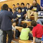 Kimani Nyambura, foreground, signs to a deaf student from Nanwalek while the school skypes into his presentation with human rights lawyer Chris Mburu Thursday, Nov. 16, 2017 at Port Graham School in Port Graham, Alaska. The pair, who are the subject of a documentary called &ldquo;A Small Act,&rdquo; presented about their journeys to education from a small village in Kenai to several Kenai Peninsula schools this week. (Photo by Megan Pacer/Homer News)