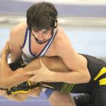 Soldotna&rsquo;s Gideon Hutchison works against New Stuhoyak&rsquo;s Blunka Blunka Jr during the 120-pound final of the Lancer Smith Memorial Saturday at the Menard Memorial Sports Center in Wasilla. (Photo by Jeremiah Bartz/Frontiersman)