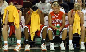 FILE - In this Nov. 26, 2003, file photo, from left, Clemson&rsquo;s Maggie Slosser, Lakeia Stokes, Julie Talley and Julie Aderhold sit on the bench after Clemson&rsquo;s 61-58 loss to Alasaka-Anchorage in the championship game of the Great Alaska Shootout on in Anchorage, Alaska. Shootout fans over the years witnessed the best of college basketball, with Duke, North Carolina, Kentucky, Michigan State and UCLA winning titles, but the end is near. The 40th Shootout will be the last, a victim of changed rules and competition.(AP Photo/Michael Dinneen, file