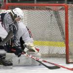 Kenai Central defenseman Bailey Maxson helps keep Soldotna forward Braxton Urban from scoring on goalie Josh Tree on Tuesday, Nov. 21, 2017, at the Kenai Multi-Purpose Facility. (Photo by Jeff Helminiak/Peninsula Clarion)