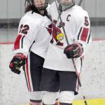 Kenai Central forward Levi Mese (5) celebrates the first of his five goals against Soldotna with Matt Hagel on Tuesday, Nov. 21, 2017, at the Kenai Multi-Purpose Facility. (Photo by Jeff Helminiak/Peninsula Clarion)