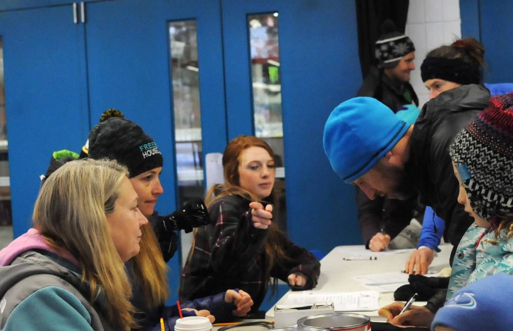 Runners sign up for the Turkey Trot race at the Soldotna Regional Sports Complex on Thursday in Soldotna. The proceeds from the run were donated to Freedom House, a Soldotna nonprofit sober living home for women recovering from addiciton. (Photo by Elizabeth Earl/Peninsula Clarion)