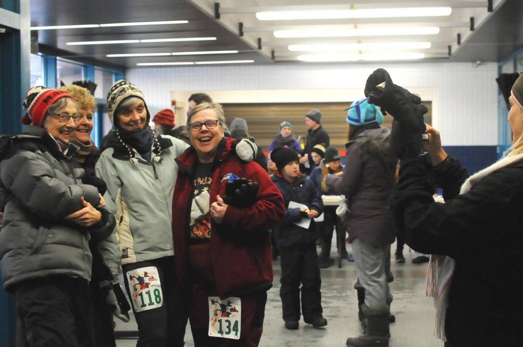 Margie McCord, Forrst Nelson, Mary Armstrong and Mary Bodnar pose for a photo before the Turkey Trot community run at the Soldotna Regional Sports Complex on Thursday in Soldotna. The group, calling themselves the &ldquo;Senior Strutters,&rdquo; walked the 5K race together in the 20-degree weather Thanksgiving morning. The proceeds from the race were donated to the Soldotna nonprofit Freedom House, a sober living home for women recovering from addiction. (Photo by Elizabeth Earl/Peninsula Clarion)