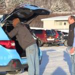 Volunteers pack up the Homer Senior Citizens Center&rsquo;s new Subaru outback with meals to be delivered through its Meals on Wheels program Monday, Nov. 20, 2017 at the center in Homer, Alaska. The center got the vehicle through a grant specifically to help with meal deliveries. (Photo by Megan Pacer/Homer News)