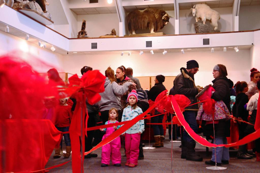 The line to meet Santa Claus at the annual Christmas Comes to Kenai event filled the Kenai Visitor Center on Friday morning in Kenai. (Photo by Ben Boettger/Peninsula Clarion)