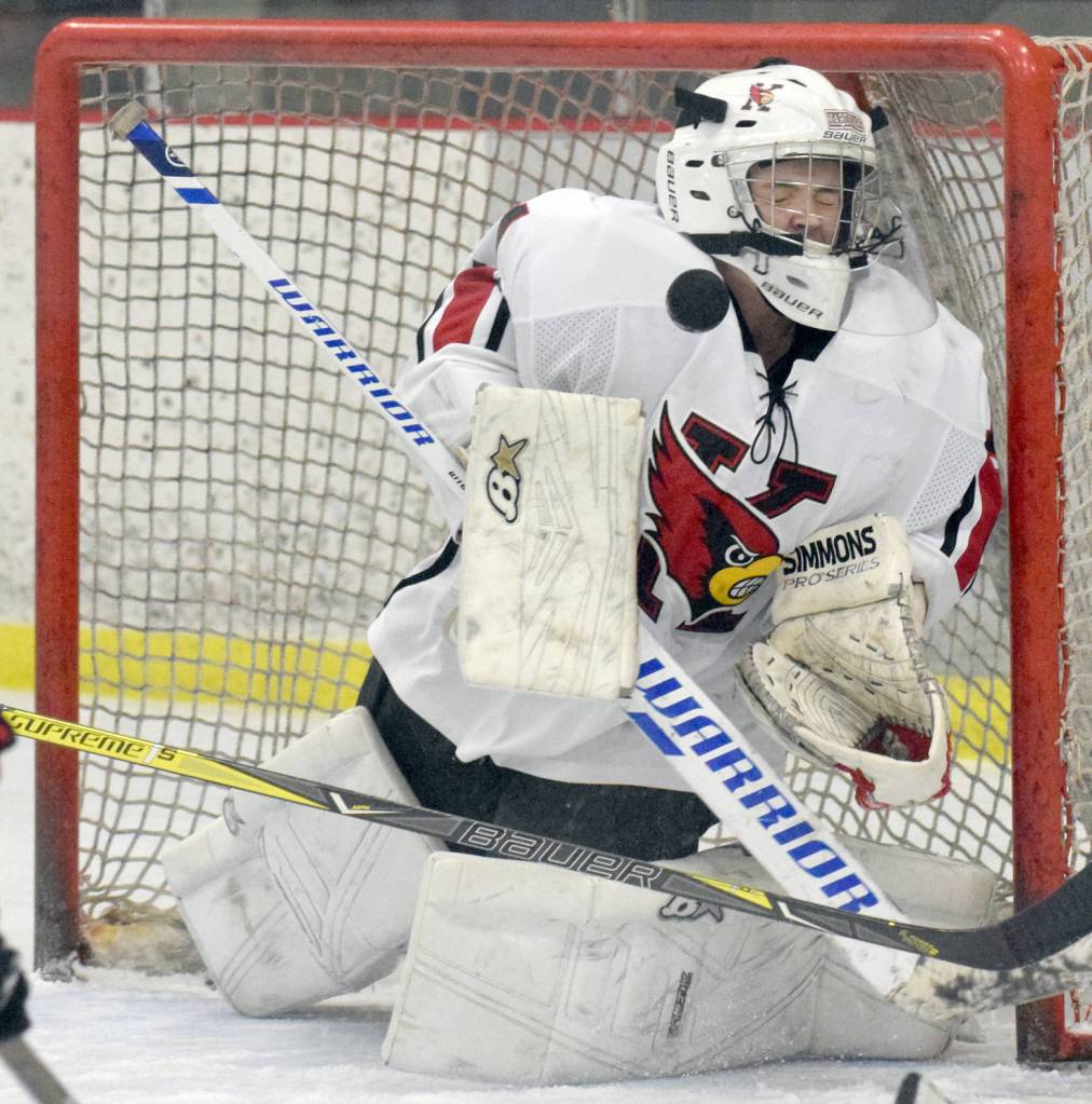 Kenai Central goaltender Josh Tree makes a save against Colony on Thursday, Nov. 30, 2017, at the Kenai Multi-Purpose Facility. (Photo by Jeff Helminiak/Peninsula Clarion)