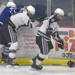 Soldotna&rsquo;s Braxton Urban skates off with the puck while Palmer&rsquo;s Nathan Hooks and Soldotna&rsquo;s Levi Brenner battle along the boards Thursday, Nov. 30, 2017, at the Soldotna Regional Sports Complex. (Photo by Jeff Helminiak/Peninsula Clarion)