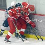 Soldotna&rsquo;s JD Schmelzenbach battles with Wasilla&rsquo;s McKinley Larson and Langston Bouma for the puck Friday, Dec. 1, 2017, at the Soldotna Regional Sports Complex. (Photo by Jeff Helminiak/Peninsula Clarion)