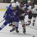 Kenai Central&rsquo;s Jakeb O&rsquo;Brien battles for the puck with Palmer&rsquo;s Zach Nelius (left) Friday at the Kenai Multipurpose Facility. (Photo by Joey Klecka/Peninsula Clarion)