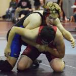 Soldotna&rsquo;s Max Rogers attempts to pin Kenai Central&rsquo;s Rocky Sherbahn in a 182-pound match Saturday at the North-South tournament at Soldotna Prep School. (Photo by Joey Klecka/Peninsula Clarion)