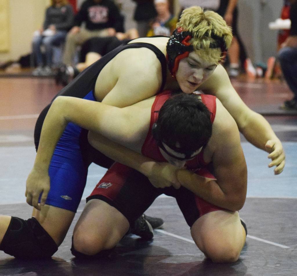 Soldotna&rsquo;s Max Rogers attempts to pin Kenai Central&rsquo;s Rocky Sherbahn in a 182-pound match Saturday at the North-South tournament at Soldotna Prep School. (Photo by Joey Klecka/Peninsula Clarion)