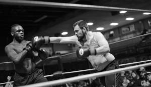 In his first match, boxer Melvin Clark, Jr., (left) evades a punch from his experienced opponent, Doug McFresh, during the Fight Before Christmas 2 matches on Saturday at the Soldotna Regional Sports Complex. Both fighters were from Nikiski. After three rounds, McFresh won. (Ben Boettger/Peninsula Clarion)