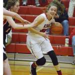 Kenai Central junior Brooke Satathite eyes an open lane against Eielson Thursday night at the Craig Jung Kenai River Challenge at Kenai Central. (Photo by Joey Klecka/Peninsula Clarion)