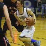 Soldotna&rsquo;s Caleb Spence (right) drives the lane against Kenai Central&rsquo;s Luke Beiser, Friday at the Powerade/Al Howard Tip-Off tournament at Soldotna High School. (Photo by Joey Klecka/Peninsula Clarion)