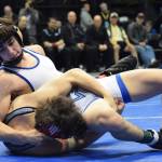 Soldotna junior Gideon Hutchison pins down Wasilla&rsquo;s Alex Logsdon in the 120-pound final Saturday night at the Division I state wrestling championships at the Alaska Airlines Center in Anchorage. (Photo by Joey Klecka/Peninsula Clarion)