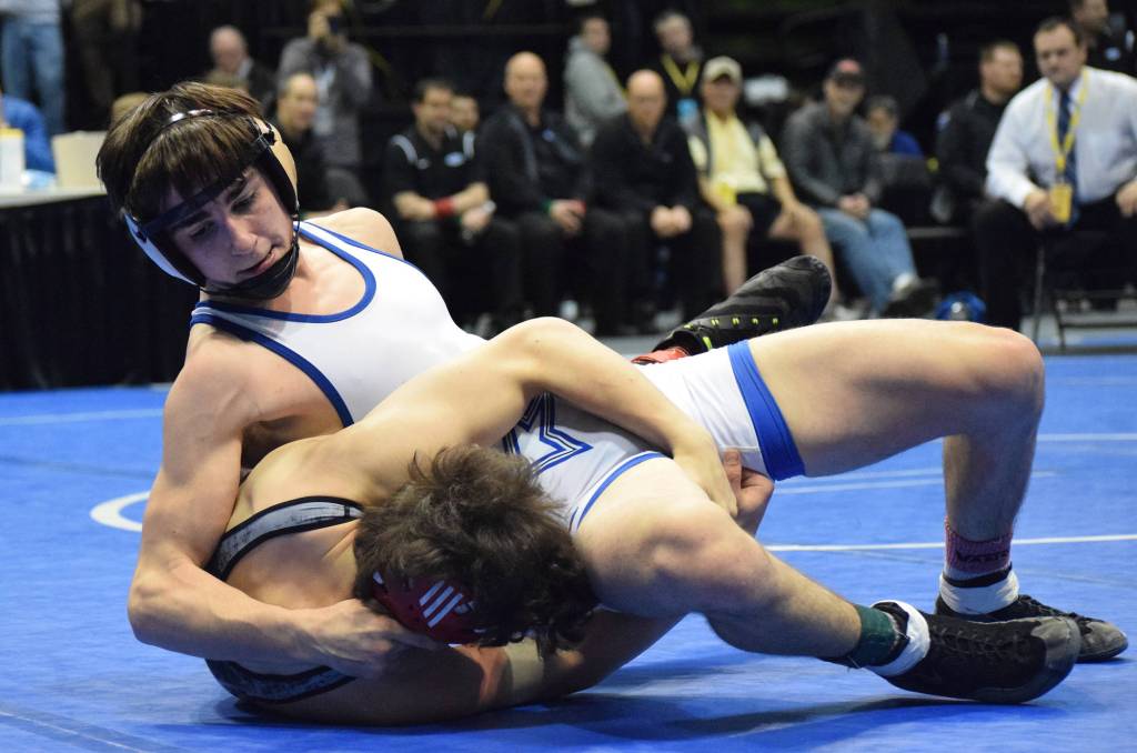 Soldotna junior Gideon Hutchison pins down Wasilla&rsquo;s Alex Logsdon in the 120-pound final Saturday night at the Division I state wrestling championships at the Alaska Airlines Center in Anchorage. (Photo by Joey Klecka/Peninsula Clarion)