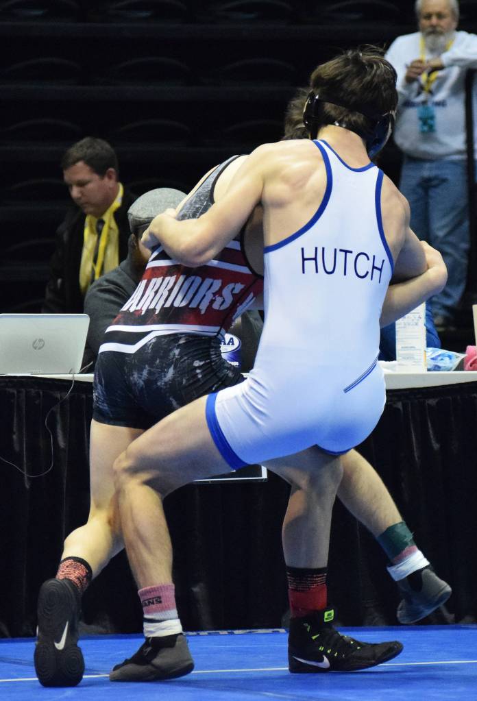 Soldotna junior Gideon Hutchison grapples with Wasilla&rsquo;s Alex Logsdon in the 120-pound final Saturday night at the Division I state wrestling championships at the Alaska Airlines Center in Anchorage. (Photo by Joey Klecka/Peninsula Clarion)