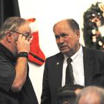 Gov. Bill Walker (right) speaks to Rep. Mike Chenault (R-Nikiski) before the beginning of a joint luncheon of the Kenai and Soldotna chambers of commerce on Tuesday, Dec. 19, 2017 in Kenai, Alaska. Walker visited Kenai on Tuesday to address the chambers of commerce with updates about the Alaska LNG Project. (Photo by Elizabeth Earl/Peninsula Clarion)
