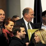 Gov. Bill Walker (center), Sen. Peter Micciche, R-Soldotna, (right) and Rep. Gary Knopp, R-Kenai, (left) stand among a group of citizens and government officials after the conclusion of a joint luncheon of the Kenai and Soldotna chambers of commerce Tuesday, Dec. 19, 2017 in Kenai, Alaska. Walker visited Kenai to address the chambers of commerce with updates on the Alaska LNG Project. (Photo by Elizabeth Earl/Peninsula Clarion)