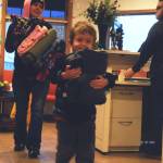 Aiden Gilliam (right) and his mother help carry in blankets the local Girl Scouts Troop 254 donated to the Kenaitze Indian Tribe&rsquo;s Na&rsquo;ini Family and Social Services for its blanket drive Tuesday, Dec. 19, 2017 in Kenai, Alaska. The girl scout troop, which includes 6th and 7th graders, collected blankets at Kalifornsky Beach Elementary School and Kenai Middle School to donate to the tribe. The blankets will be available for clients in need at the Na&rsquo;ini Family and Social Services building and some will be distributed at the Project Homeless Connect event in January 2018. (Photo by Elizabeth Earl/Peninsula Clarion)