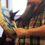 Local musician George Demientieff Holly plays a drum and sings during a Dec. 21 performance in honor of the winter solstice at the Dena&rsquo;ina Wellness Center in downtown Kenai. (Photo by Erin Thompson/Peninsula Clarion)