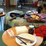 Homemade bread and jelly are provided to the community at a Dec. 21 winter solstice performance at Dena&rsquo;ina Wellness Center in downtown Kenai. (Photo by Erin Thompson/Peninsula Clarion)