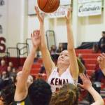 Kenai Central sophomore Kailey Hamilton reaches for a rebound amid a group of Kenai and Seward players Thursday night at Kenai Central High School. (Photo by Joey Klecka/Peninsula Clarion)