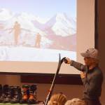 Tony Doyle points out the finer details in a photo presentation Dec. 20 at the Kenai Visitors and Cultural Center. (Photo by Joey Klecka/Peninsula Clarion)