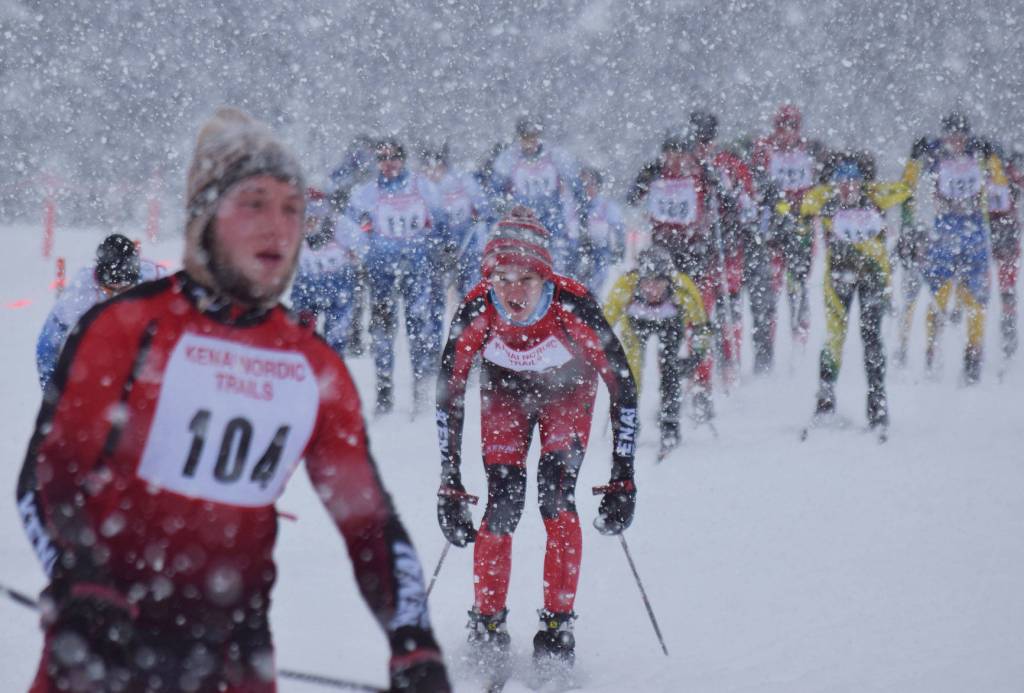 Kenai Central&rsquo;s Eric Kempf eyes teammate Patrick Michels (104) ahead of him at the start of the Kenai Klassic boys ski race Jan. 20, 2017, at the Kenai Golf Course. (Photo by Joey Klecka/Peninsula Clarion)